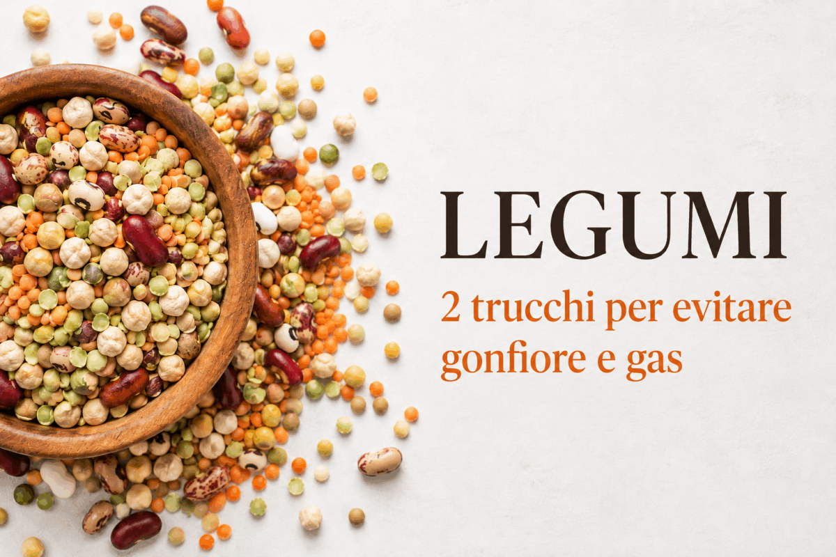 Ciotola di legumi misti su sfondo chiaro con spiegazione sul come evitare gas e pancia gonfia